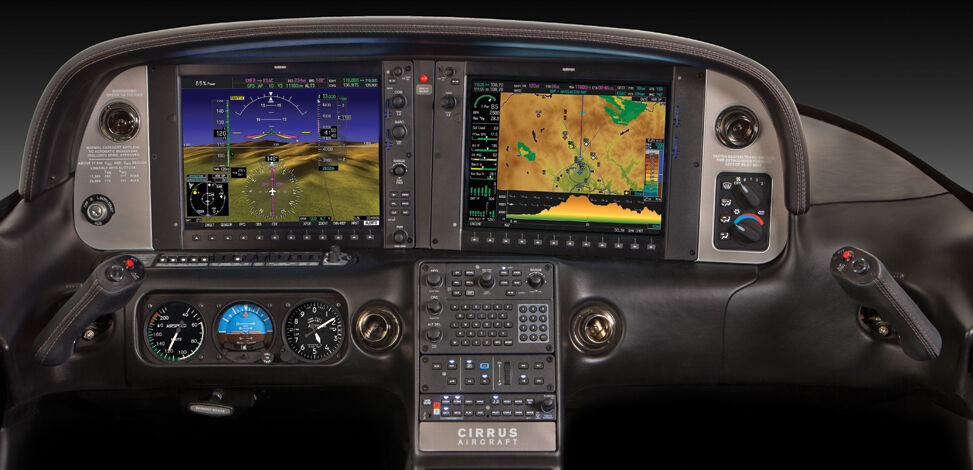 A Cirrus Perspective instrument panel with two large glass displays, a central keypad and standby instruments beneath